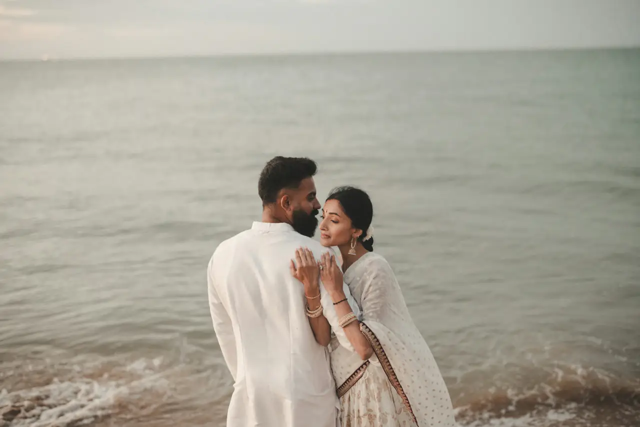 Meera and Dev by the sea