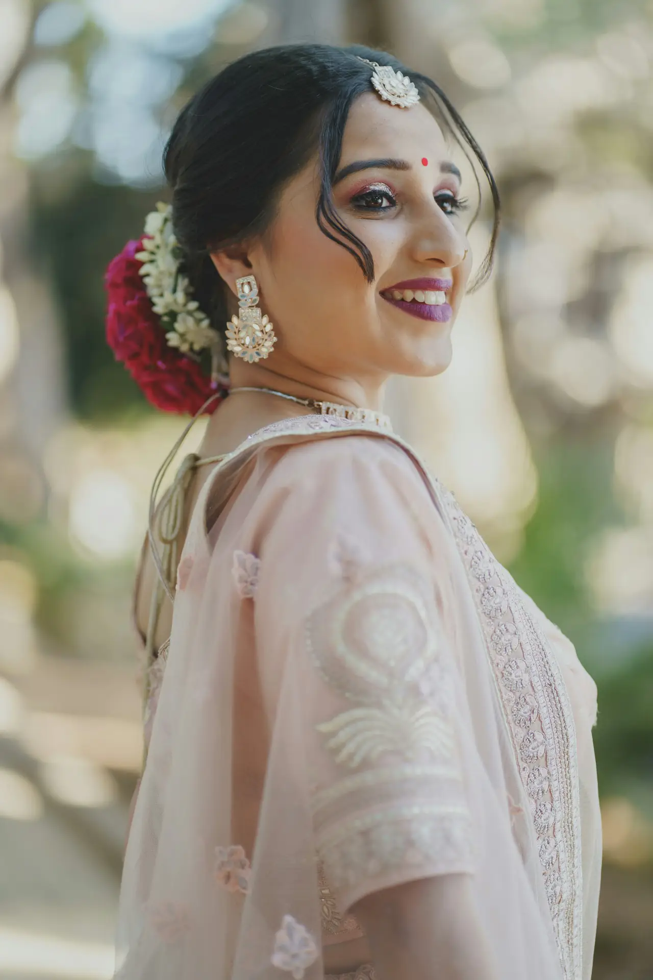 Smiling bride in blush