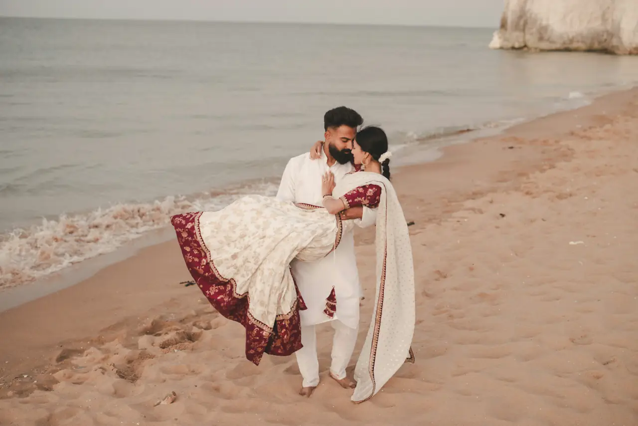 Couple on the beach at golden hour