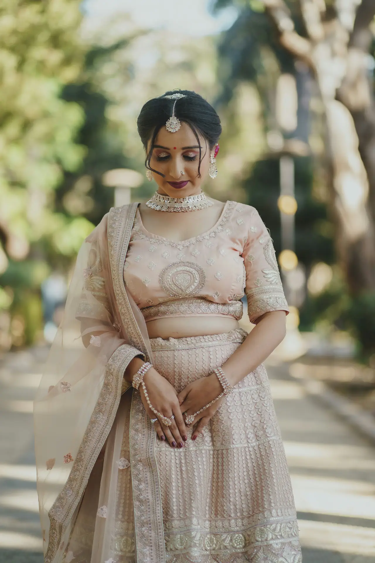 Bride in a soft pastel lehenga